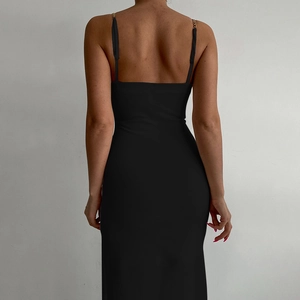 Elegant black bodycon midi dress featuring gold chain straps and an open back design