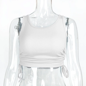 Detail view of white ribbed knit crop top featuring side drawstring ruched texture