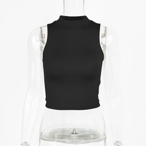 Close-up of black sleeveless crop top with fine ribbed texture and high neck design