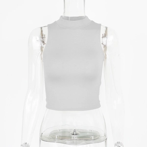 Detailed shot of light grey mock neck crop top showing fine ribbed knit fabric texture