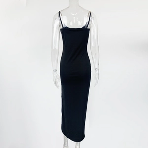 Detail of black slim-fit maxi dress featuring elegant metal chain link shoulder straps