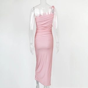 Detail view of pink bodycon dress featuring horizontal ruching and sleek fabric texture