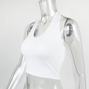 Detail of white ribbed knit fabric on a slim fit halter neck crop top for women