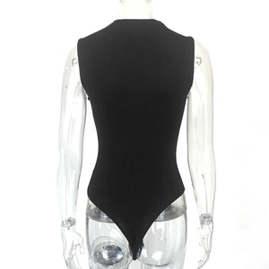 Detail view of black sleeveless bodysuit with high-cut leg and slim fit on mannequin
