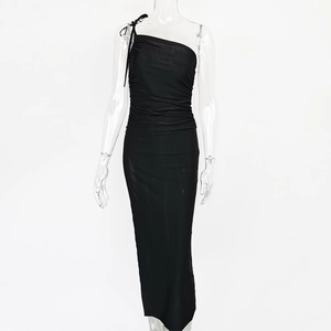 Detail of elegant black one-shoulder ruched dress with side slit and slim fit design