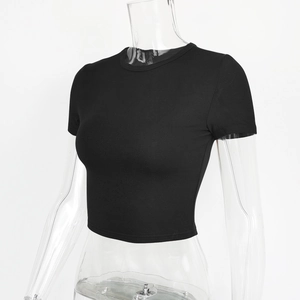 Close-up of black crew neck crop top t-shirt showing slim fit cut and elastic ribbed texture