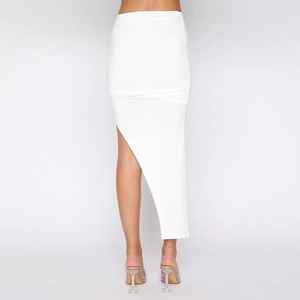Detailed view of the white ruched design and asymmetrical hemline on the fashion skirt