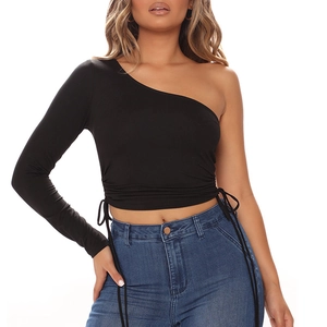 Detail of adjustable drawstring ruching on a slim fit black one shoulder crop top