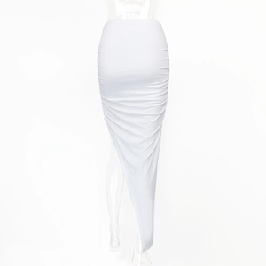 Detailed view of white high-waisted ruched skirt with asymmetric hemline and textures
