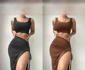 Detail of slim fit crop top and side drawstring slit skirt set in black and brown