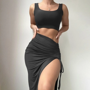 Chic two-piece set featuring cropped tank top and side drawstring high slit maxi skirt