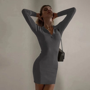 Detail of grey ribbed knit dress with polo collar and slim-fit bodycon texture