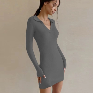 Close-up of ribbed knit texture on a dark grey bodycon dress with long sleeves