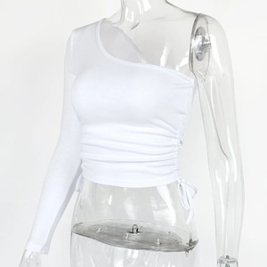 Detail of white one-shoulder long sleeve crop top with side ruched drawstring design