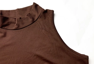 Detailed view of the dark brown mock neck sleeveless dress with fine knit texture