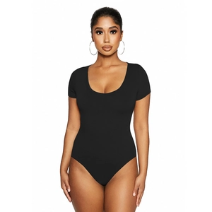 Close-up of a black short sleeve bodysuit with a low scoop neckline in slim fit style