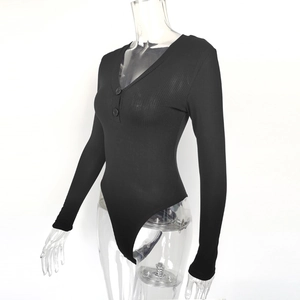 Close-up of ribbed texture and black button details on a slim-fit V-neck bodysuit