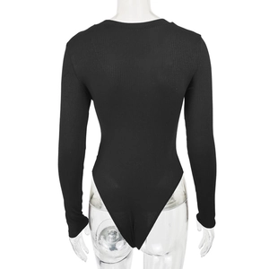 Rear view of black long sleeve ribbed bodysuit showing full back coverage on a model