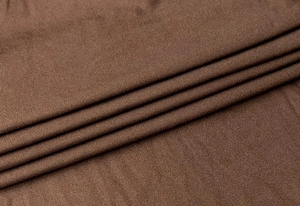 Close-up of dark brown ribbed knit fabric detail showing elastic vertical textures