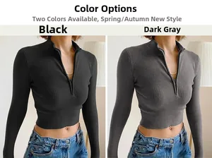 Detail of ribbed long sleeve crop top with zip-up high collar in black and dark grey