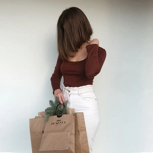 Detail shot of the square neck design and slim fit of this brown long sleeve crop top