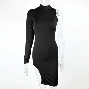 Detail of high-slit hem and asymmetric one-shoulder design on a black slim knit dress