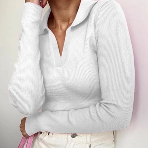 White ribbed long sleeve polo shirt for women featuring a slim fit cropped V-neck design