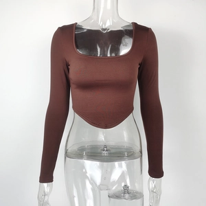 Detail of deep brown square neck crop top featuring a unique curved hem and slim fit sleeves