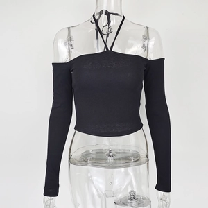 Detailed view of the ribbed texture and halter neck tie on this slim fit black top