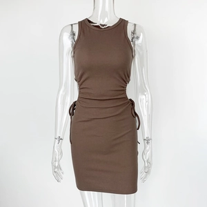 Close-up of brown ribbed dress featuring side cut-outs and adjustable drawstring details