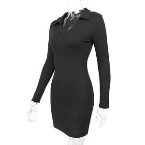 Detail of black ribbed knit dress showing the polo collar and V-neckline texture