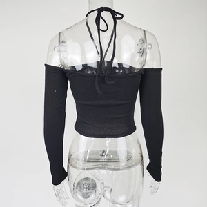 Detailed back view of black off-shoulder ribbed crop top with halter strap detail