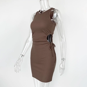 Close-up of brown ribbed knit dress featuring side waist cutout and lace-up detail