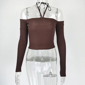 Detail of brown ribbed knit top featuring a halter neck and off-shoulder long sleeves