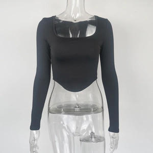 Detail of square neck black long sleeve crop top with stylish curved pointed hem