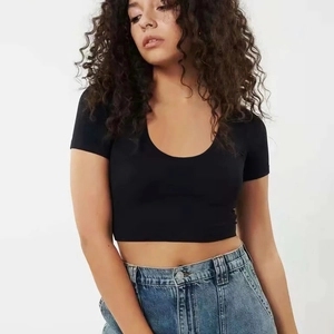 Slim fit black U-neck crop top short sleeve T-shirt paired with high-waist jeans