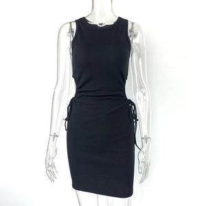 Detail of the side drawstring ruching and textured ribbing on the black bodycon dress