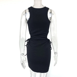 Detail view of the black ribbed knit fabric and adjustable side drawstrings of the dress