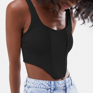 Close-up of black ribbed corset top with curved hem and vertical texture detail