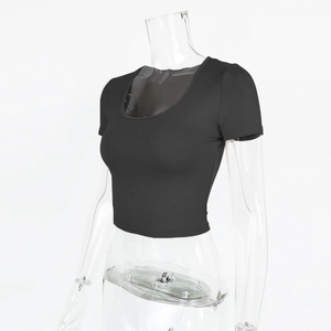 Detail view of black slim fit crop top with ribbed texture and classic round neck