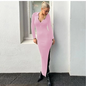 Detail view of the ribbed knit fabric, Polo collar and button neckline of the pink dress