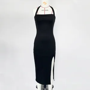 Close-up of the elegant high-slit design on this slim black halter maxi dress for women