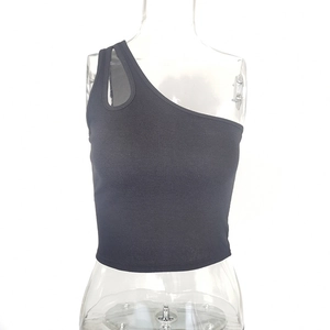 Detailed view of black one-shoulder ribbed crop top featuring an asymmetric oval cutout