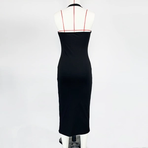 Detail of the backless halter design on this slim fit black midi dress for women