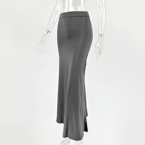 Detail view of the soft elastic fabric and ruched texture on this dark grey maxi skirt