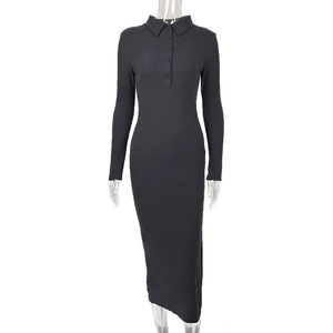 Detail of black polo neck ribbed knit dress with button neckline and slim long sleeves