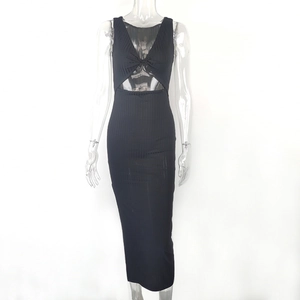 Detail of black sleeveless dress featuring a knot chest detail and waist cut-out design