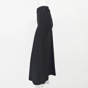 Detail of high-waist black bodycon skirt with pleated fishtail hem and slim fit cut