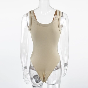 Detail of beige ribbed knit fabric on a slim fit sleeveless bodysuit with a round neck