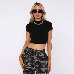 Women's slim fit black crop top with camo cargo pants in street style outfit